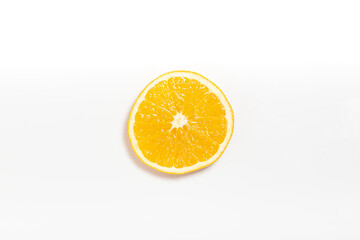 Orange slice isolated on white. Top view.
