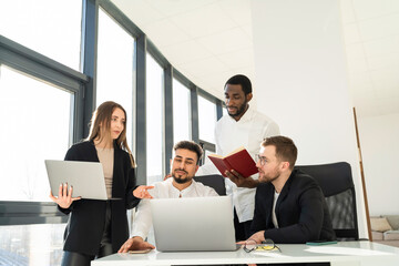 Group of multiracial people company employees working on laptops
