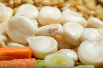 Dried maize mote and bulgur wheat and carrot. Close up. Macro photography