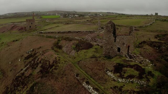 Aerial orbit around the stone house ruins of the tin mines in Cornwall, England, part of the stunning scenery used in the Masterpiece Theater presentation of Poldark.