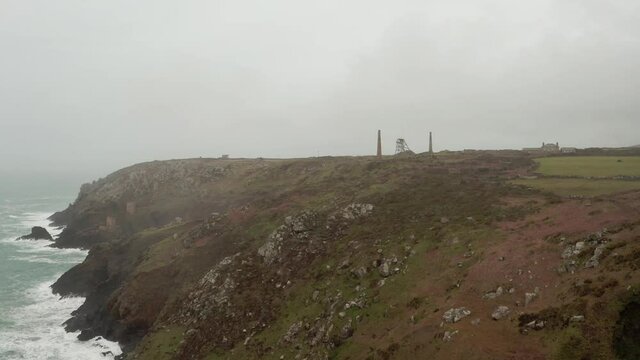 Aerial orbit around the stone stacks at the tin mines in Cornwall, UK.