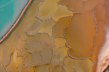 Cracking and drying sea water ponds of solar salt mine through sea water evaporation at Useless Loop in Western Australia