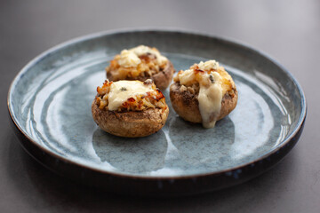 Stuffed mushroom caps with cream cheese, breadcrumbs and parmesan