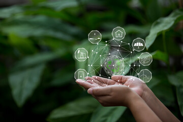 Technology, hand holding with environment Icons over the Network connection on green background.