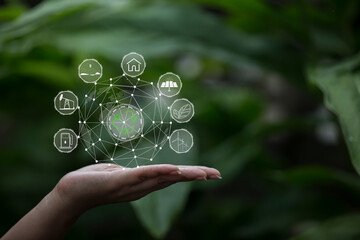 Technology, hand holding with environment Icons over the Network connection on green background.