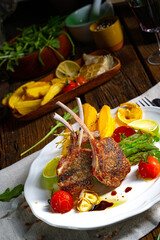 Lamb chops marinated in herbs with green asparagus and lime