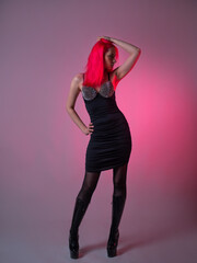 Goth sexy look. young attractive woman with pink hair