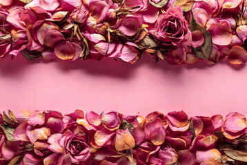 Frame made of dried rose flowers, petals, and leaves.