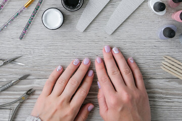 Modern female nude design manicure. Nail care, Self care. Professional Hardware Manicure. Procedure...