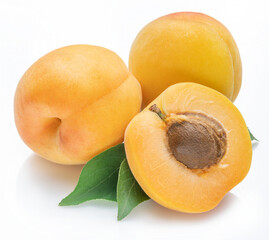 Ripe apricots with leaves isolated on white background.