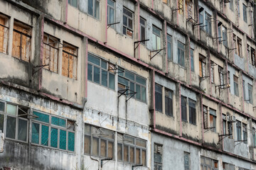 Fototapeta na wymiar Exterior of abandoned residential building in Hong Kong city