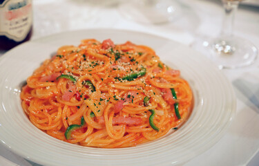 A meal of spaghetti on a plate at the table
