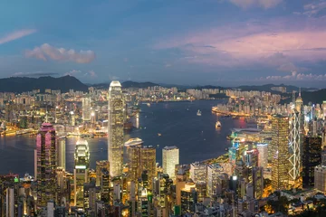 Fotobehang Panorama of Victoria Harbor of Hong Kong city at dusk © leeyiutung