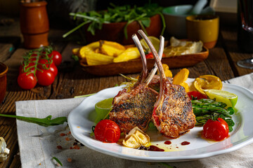 Lamb chops marinated in herbs with green asparagus and lime