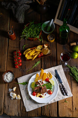 Lamb chops marinated in herbs with green asparagus and lime