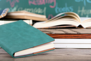 Books in front of the blackboard