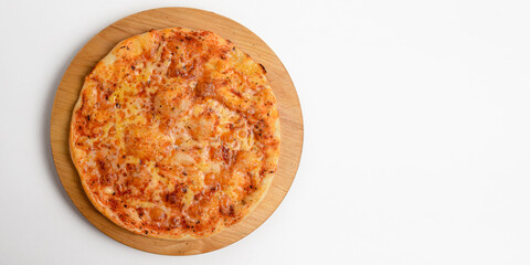 Delicious cheese pizza isolated on awhite background. Top view, flat lay, copy space banner.
