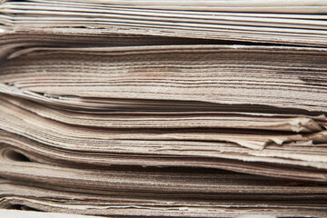 Stack of newspaper, close-up. Journalism concept