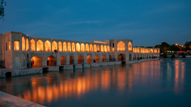 Isfahan, Iran - May 2019: Iranian people around Khaju bridge, built over Zayandeh river. Long exposure shot, blurring is intentional.