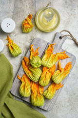 Cooking squash blossom or Zucchini flowers - type of edible flowers. Top view, vertical image.