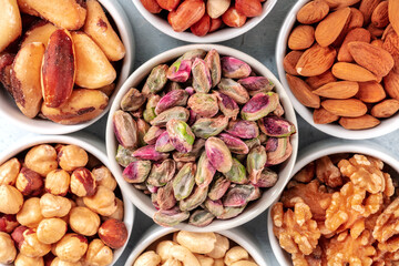 Nuts assortment close-up shot. Pistachios and Brazil nuts, almonds and hazelnuts, walnuts