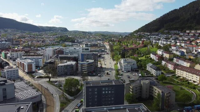 Forward moving aerial of Danmarksplass and highway E39 through Krohnstad and Minde leading to Arstad and Nesttun - Spectacular aerial overview with road in center