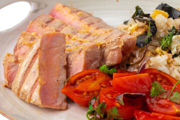 Grilled pork chop and rice with sauce