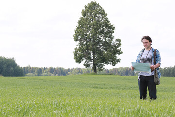 A young man looks at a map