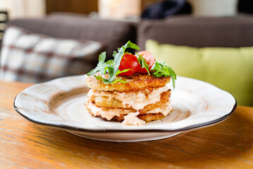 potato pancakes with sauce and vegetables