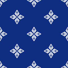 Seamless pattern with a pattern of the silhouette of tulips and leaves. Design in blue for printing, packaging, fabric. Damascus styling. Vector illustration