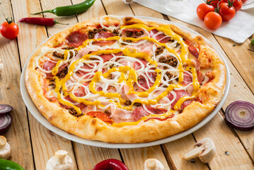 tasty pizza on the wooden background