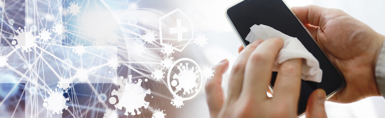 Сleaning concept. Wipe dirt off surfaces. Disinfectant treatment of phone screenl. Sanitary treatment at home quarantine.