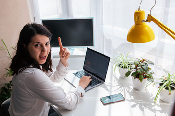 woman freelancer working on laptop white screen copy space