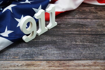 911 alphabet letters with USA Flag on wooden background