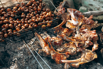 Charcoal grilled champignons and lamb ribs close up