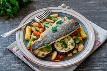 Sea bass with tomato and butter bean ragout