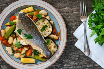 Sea bass with tomato and butter bean ragout