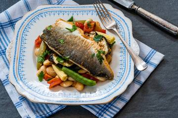 Sea bass with tomato and butter bean ragout