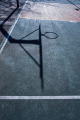 street basketball hoop shadows on the court © Ismael