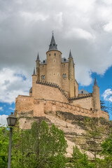 Fototapeta na wymiar Majestic detailed front view at the iconic spanish medieval castle palace Alcázar of Segovia