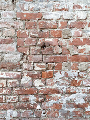 old red brick wall texture. Brick wall of historical bricks. Vertical photo, closeup.