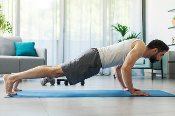 Man doing push ups at home