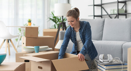 Woman unpacking in her new apartment