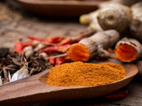 Tamaric in wooden spoon. Asian popular cooking ingredients, dry hot healthy cook herbs. view form above and copy space background.