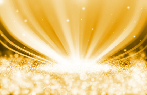 Gold sparkle rays glitter lights with spotlight bokeh elegant show on stage abstract background. Dust sparks background.Spotlight background