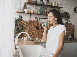 young woman preparing breakfast in the kitchen