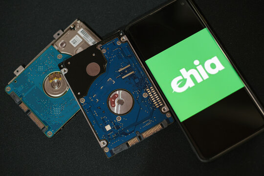 New green crypto currency Chia on a smartphone,hhd storage space coin mining farming