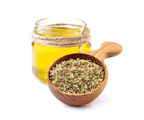 Olive oil with herbs dried isolated on white background. Oil with spices.