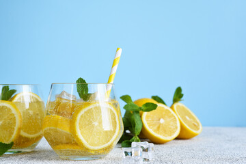 Cold lemonade with mint and lemon juice. Fresh summer drink. Mahito with lemon.