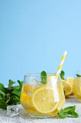 Cold lemonade with ice and lemon juice. Fresh summer drink.